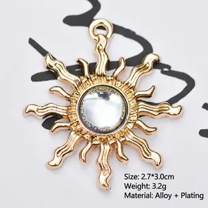 Detailed view of golden alloy sun flower pendant with iridescent gem and 2.7x3.0cm size