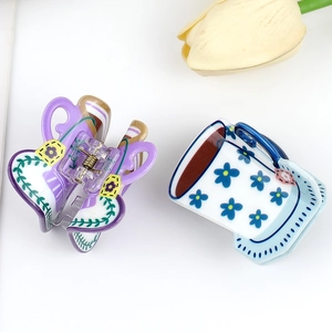 Cute coffee cup floral hair claws in purple and blue patterns for elegant hair styling
