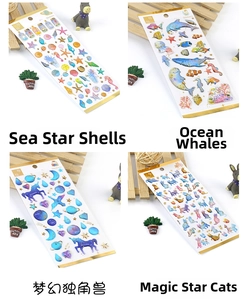 Detailed macro view of bronzing crystal epoxy stickers with nautical and unicorn motifs