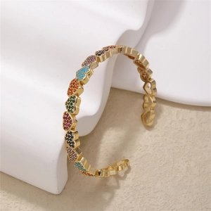 Chic gold heart bangle bracelet featuring colorful rainbow pave zircon heart charms
