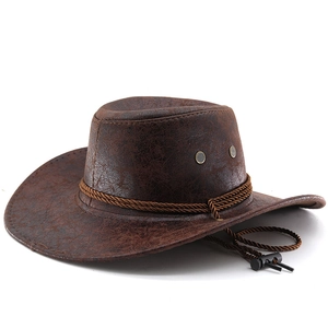 Close-up of brown leather western cowboy hat with woven band and vintage air vents