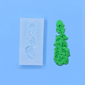 DIY floral vine silicone cake mold with 3D flower leaf texture on blue background