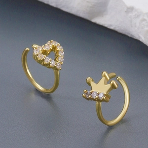 Golden nose ring and ear cuff set with rhinestone heart and crown designs in close-up