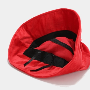 Red cotton bucket hat featuring internal sweatband and adjustable drawstring interior