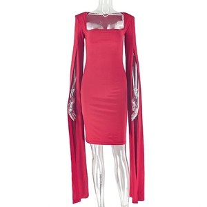 Detail of red bodycon dress with dramatic split cape sleeves and a square neckline