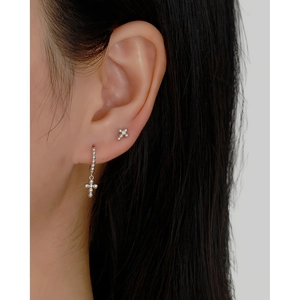 Close-up of S925 silver beaded cross stud earrings worn on model for a dainty look