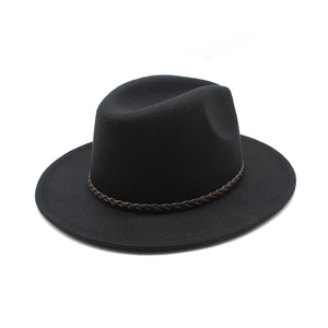 Close-up of black wool fedora featuring a classic dented top and brown braided leather belt