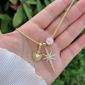 18K gold plated necklace featuring heart, starburst, and pink enamel bead pendants