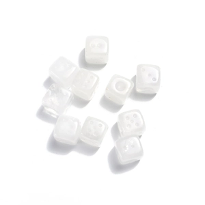 Macro shot of 15mm white natural stone dice beads for creative DIY jewelry crafts