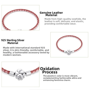 Detail of red braided leather bracelet with S925 sterling silver four-leaf clover charm