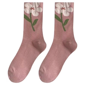 Pink crew socks with white 3D flower pattern and ribbed cuffs for sweet style