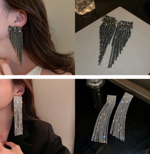 Macro view of crystal tassel drop earrings with sparkling rhinestone fringe details
