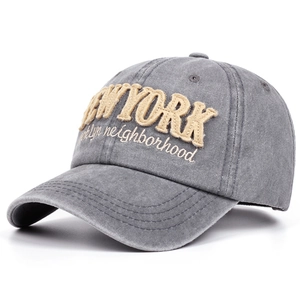 Detail of vintage washed grey baseball cap featuring 3D New York embroidery and stitching