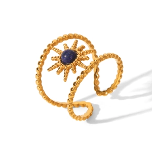 Golden stainless steel sun ring with blue gemstone center in an open adjustable design
