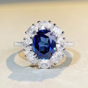 Classic S925 sterling silver halo ring with oval blue gemstone and white zircon accents
