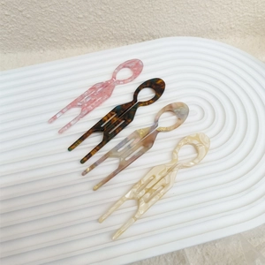 Set of four tortoiseshell acetate U-shaped hair forks in pink beige and brown marble tones