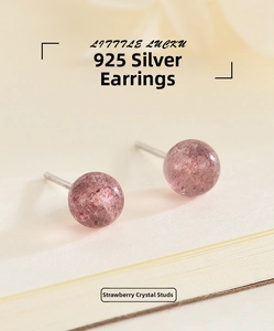 Detail shot of round strawberry crystal stud earrings with S925 silver needles
