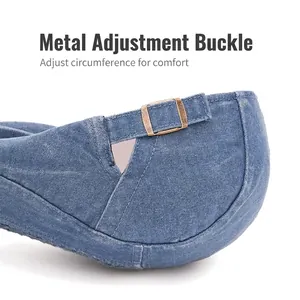 Blue washed denim newsboy hat featuring an adjustable antique bronze metal buckle closure