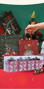 Detail of red Christmas gift box ornaments with white snowflakes in a clear pack