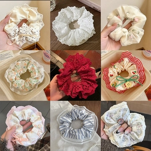 Collection of nine floral and lace hair scrunchies with elegant ribbon bow details