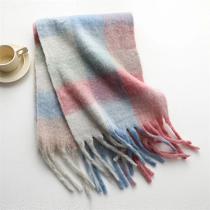 Close-up of rainbow plaid cashmere-feel scarf with long tassels and thick knit texture