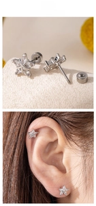 Macro detail of star-shaped zircon stud earrings with secure screw-back ball closures