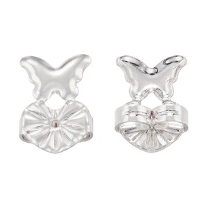 Macro detail of silver butterfly earring backs providing support and lift for stud earrings
