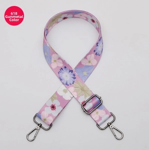 Close-up of adjustable floral strap with gunmetal hardware for shoulder bags