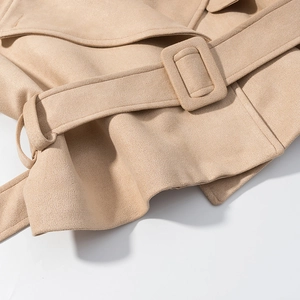 Detail shot of beige faux suede jacket featuring a wide waist belt and square buckle