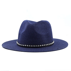 Dark blue woven cowboy straw hat with silver studded leather band for sun protection