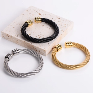 Three-color twisted cable open cuff bracelets in gold, silver, and black stainless steel