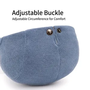 Blue corduroy beret hat with adjustable metal buckle side detail on white background