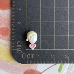 Detailed size view of a 1cm miniature resin strawberry ice cream shell accessory