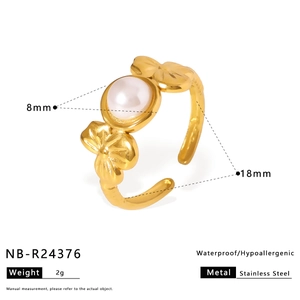 Detail showing 8mm pearl and flower design on an adjustable stainless steel ring