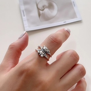 Detail of vintage sterling silver bear ring with double-layered open band design