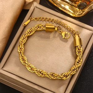 Detail of 18K gold double twisted chain bracelet with S.STEEL stamp and adjustable clasp