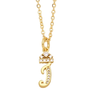 Close-up of gold J-letter pendant necklace with tiny crown and sparkling crystal stones