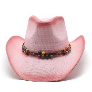 Pink western straw cowboy hat featuring colorful wooden beads decoration on a white background