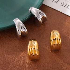 Modern double-layered teardrop gold and silver stud earrings with high-polish mirror finish