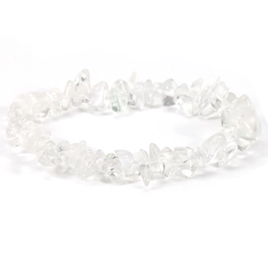 Detailed macro shot of irregular clear quartz crystal beads on an elastic bracelet
