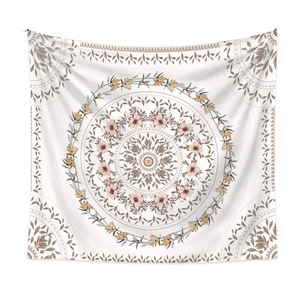 Close-up of white bohemian mandala tapestry showing intricate floral and geometric patterns