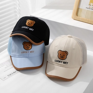Detailed close-up of lucky bear embroidered mesh baseball caps in black, blue and beige colors