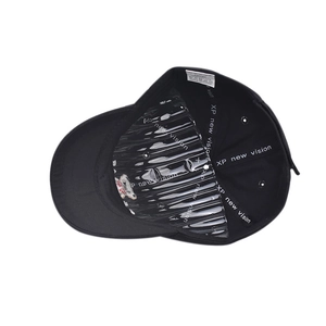 Detail of black cotton baseball cap interior with 100% cotton label and inner lining