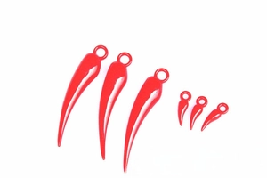 Close-up of vibrant red plastic chili charms with glossy finish for festive DIY crafts