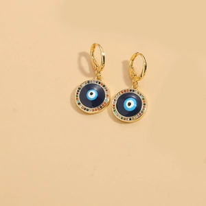 Detailed view of evil eye hoop earrings with blue enamel and colorful zircon accents