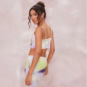 Detail of pleated fabric texture and abstract marble print on two-piece strap set
