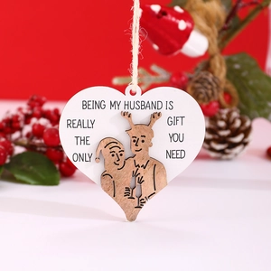 Detailed view of heart-shaped wooden husband plaque with twine and festive berries