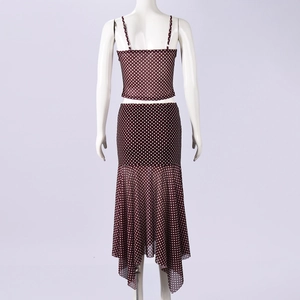 Detail view showing the semi-sheer mesh fabric and white polka dots on brown two-piece set
