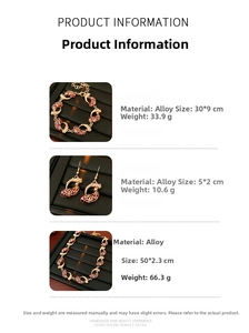 Detail view of gold alloy jewelry set with red enamel water drop pendants and zircons