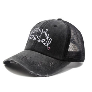 Detail of simply blessed embroidery and pink cross on washed mesh baseball cap